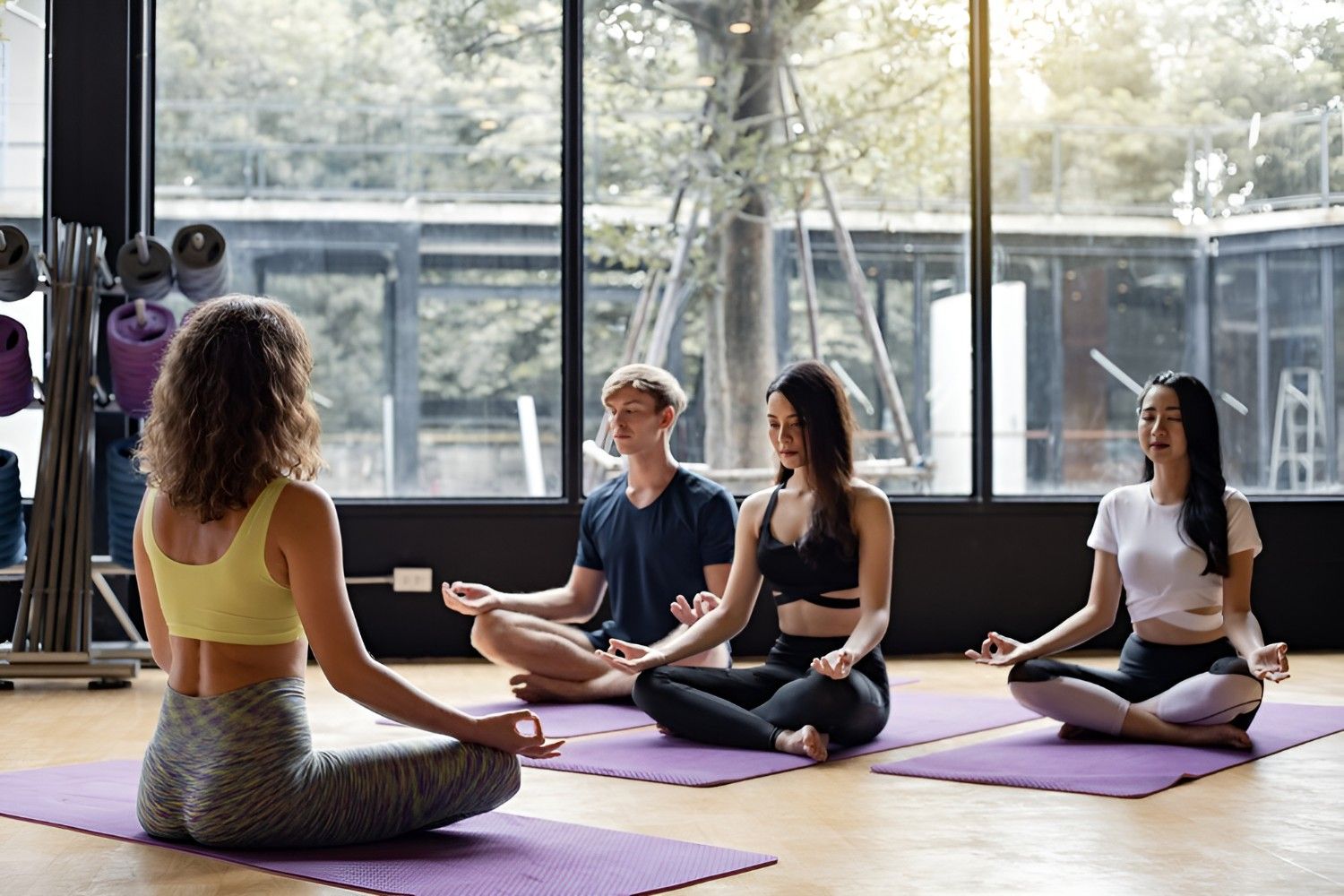 group-young-people-doing-yoga-yoga-mat-with-trainer-gradually-teaching_35150-1326-Picsart-AiImageEnhancer (1)