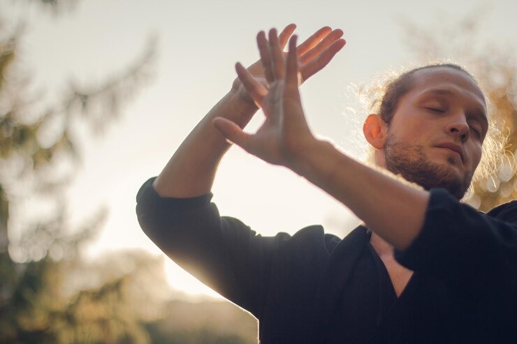 imageye___-_young-man-with-eyes-closed-gesturing-sunset_1048944-29989161