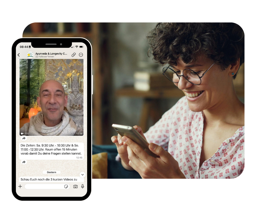 a group of people sitting on mats with hands together